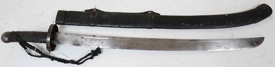 A Chinese Boxer Rebellion period sword, broad single edge blade, iron mounts, in its fish skin covered scabbard with iron mounts, blade 73.5cm. Condition - good